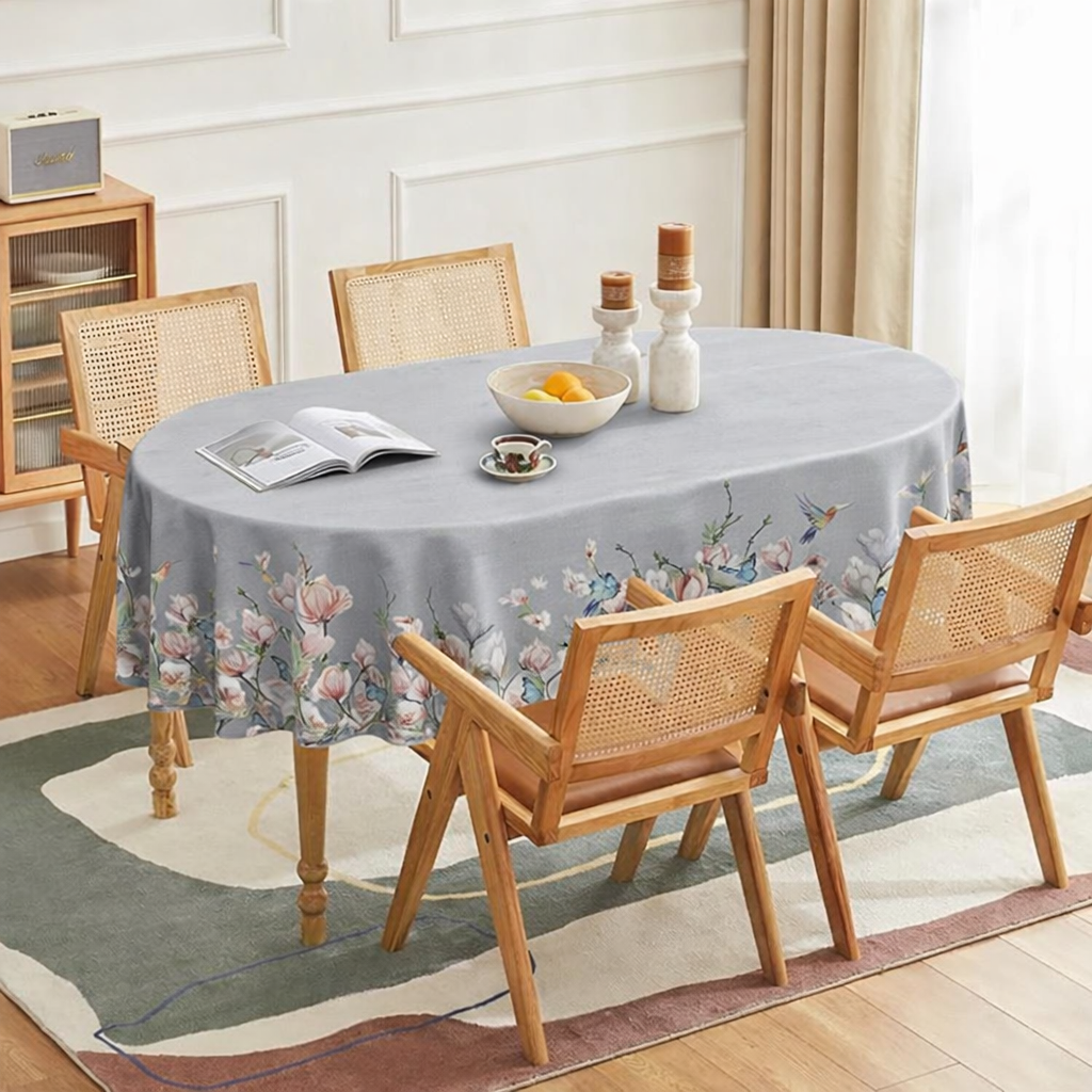 Elegant light grey floral tablecloth styled on a modern dining table