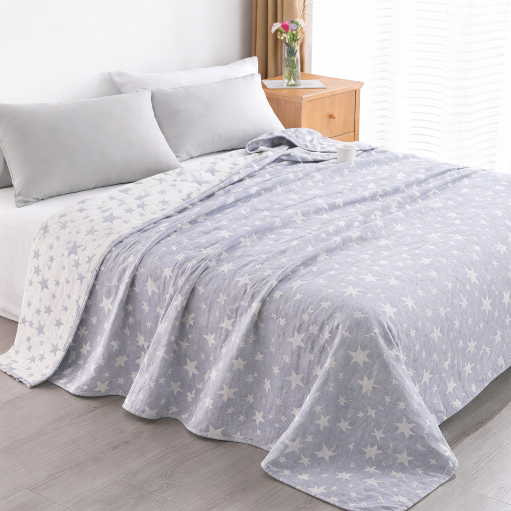Premium light grey quilt with star pattern styled on a modern bedroom bed